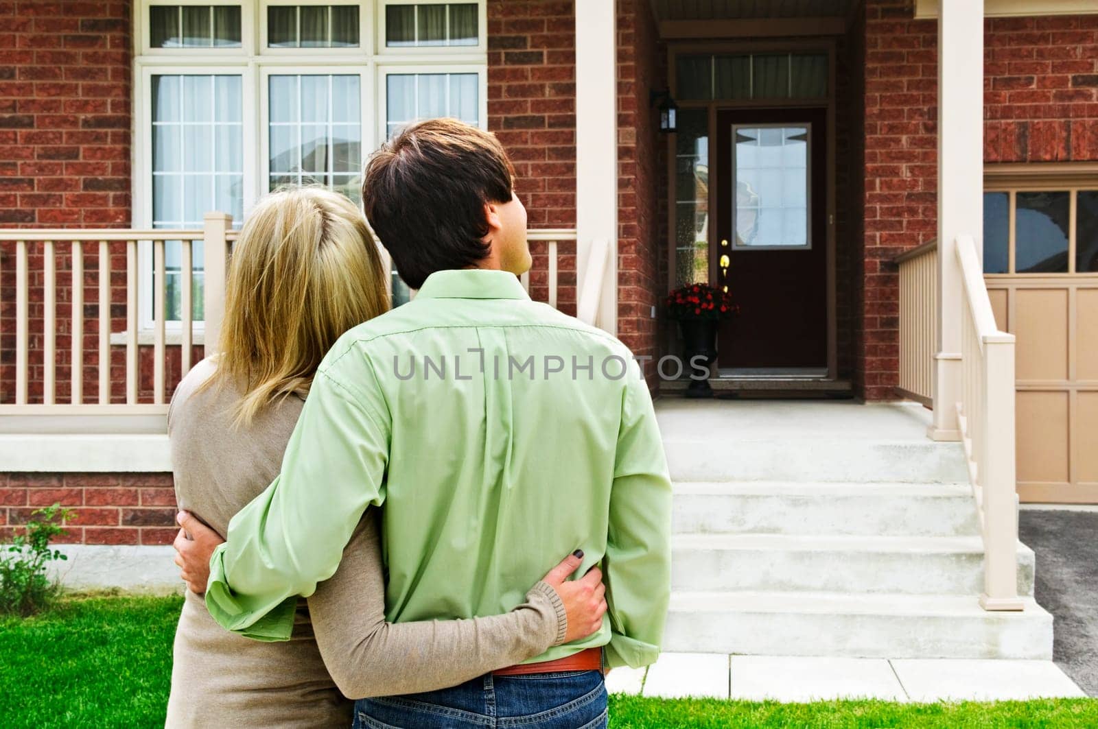 Young happy couple shopping for new home