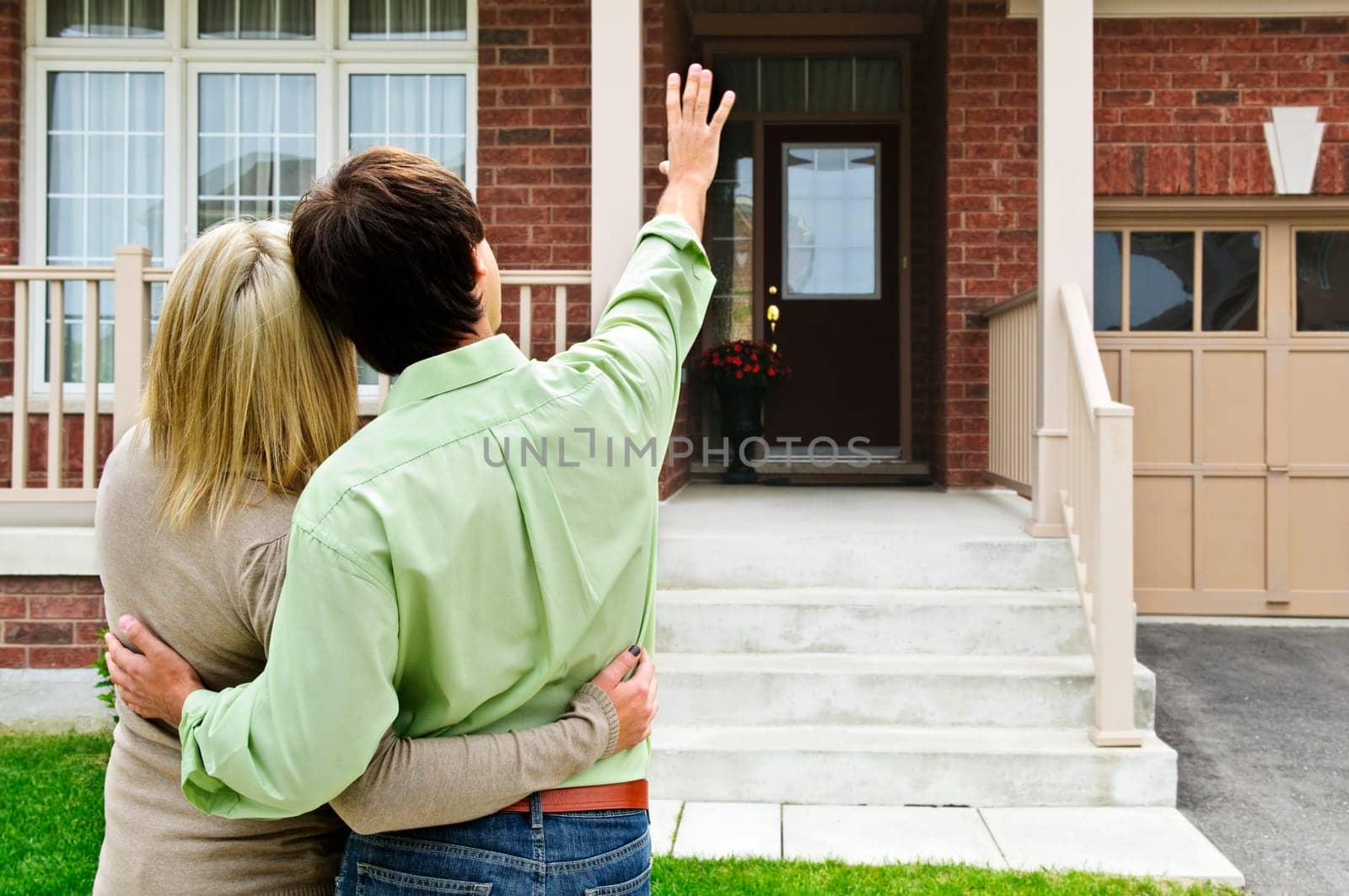 Young happy couple shopping for new home
