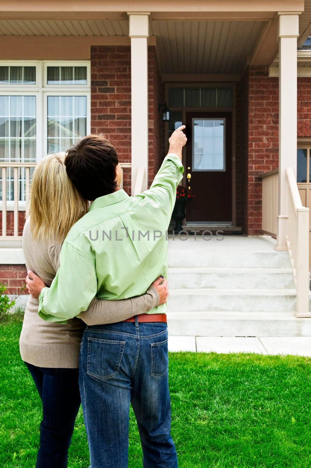 Young happy couple shopping for new home