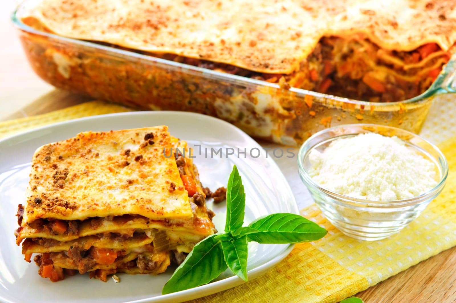 Fresh baked lasagna casserole with a serving cut
