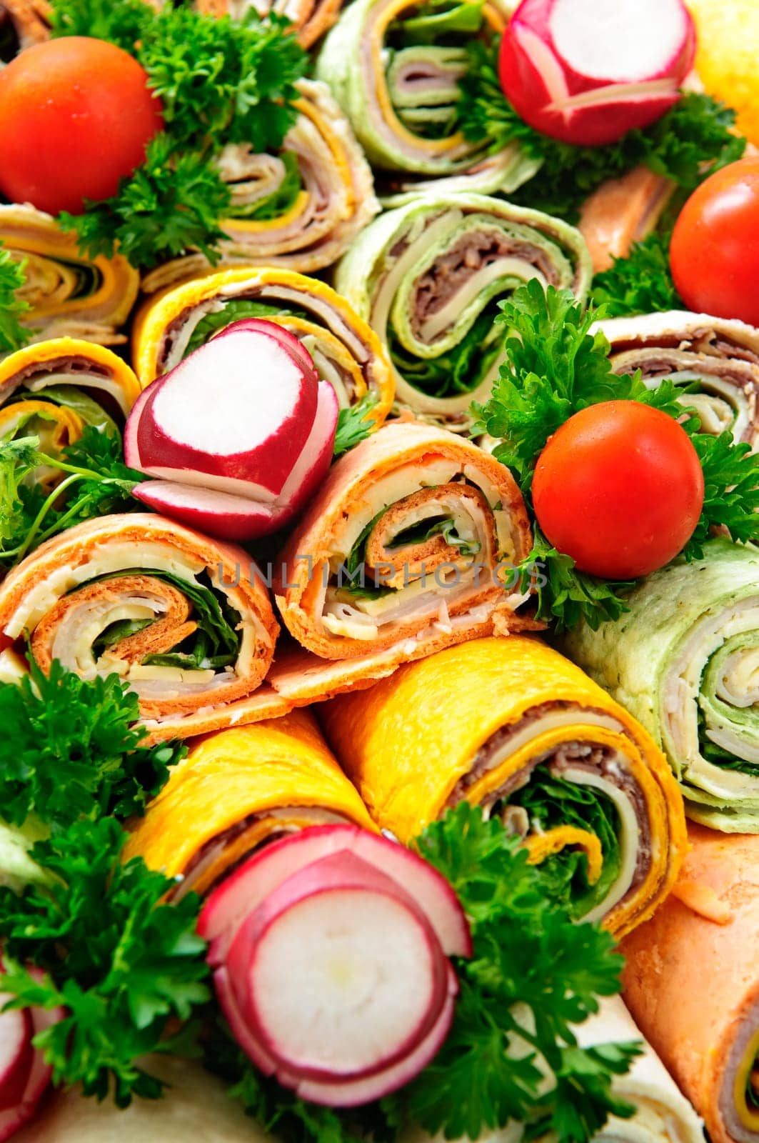 Closeup on platter of assorted meat tortilla wraps