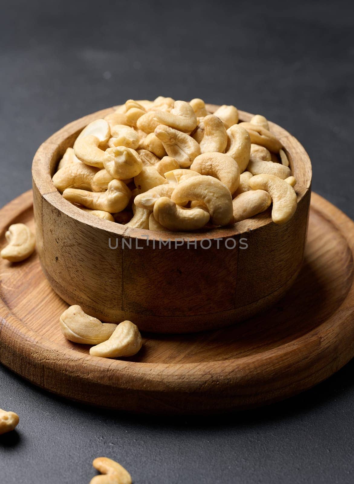 Cashews in a wooden bowl on the table