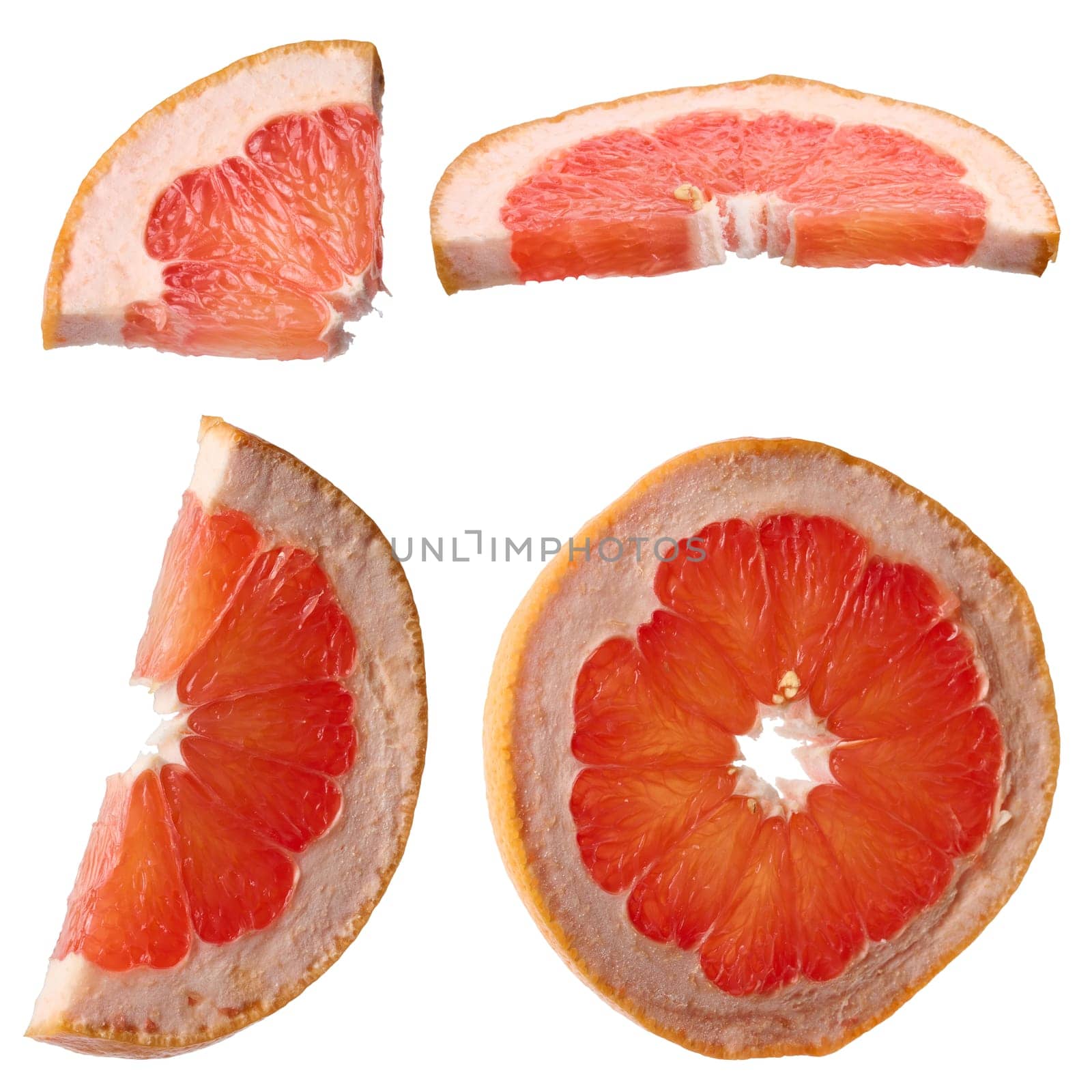 Various pieces of ripe grapefruit on a white isolated background