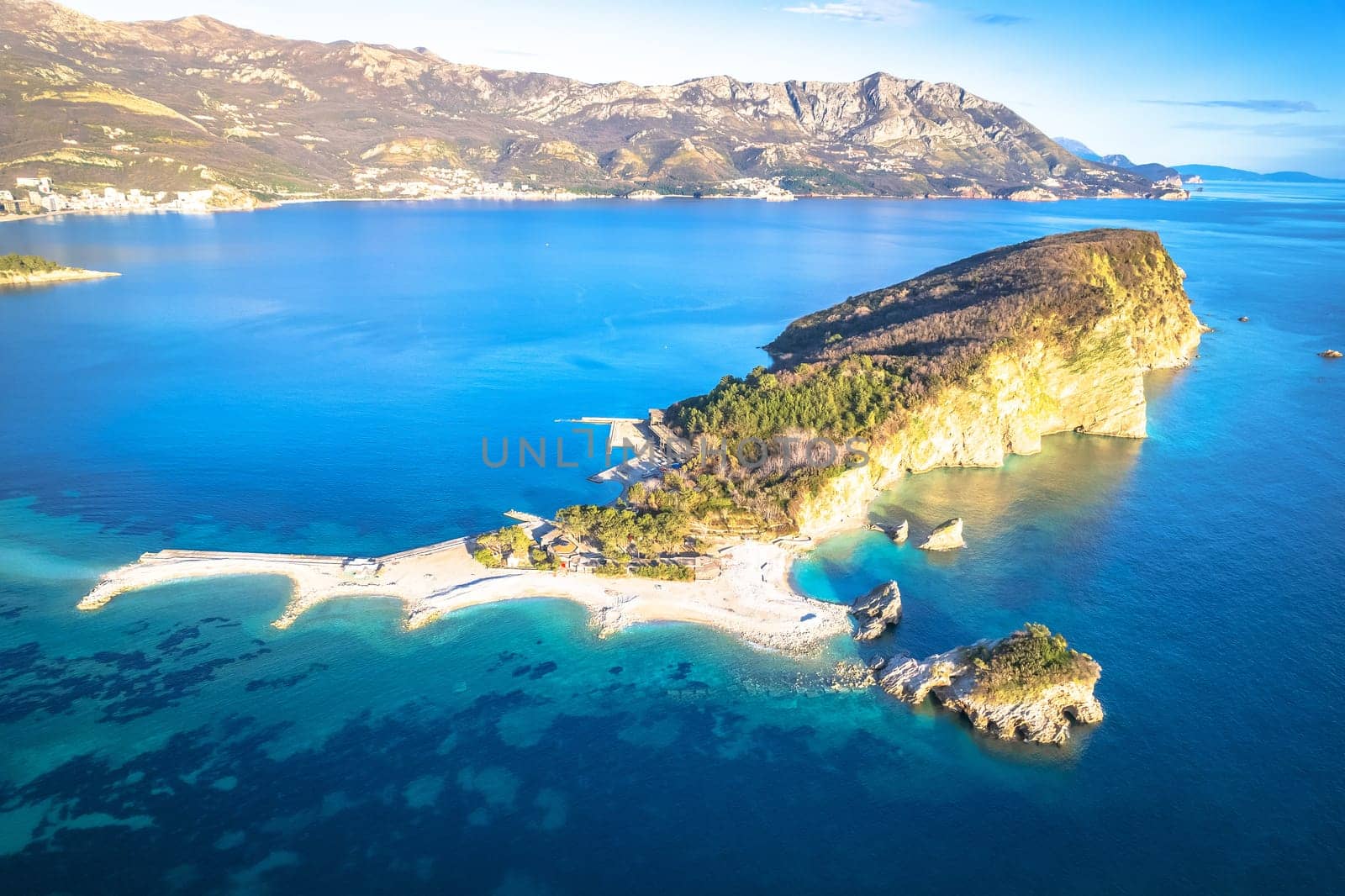 Saint Nikola island in Budva waterfront aerial view, coastline of Montenegro 
