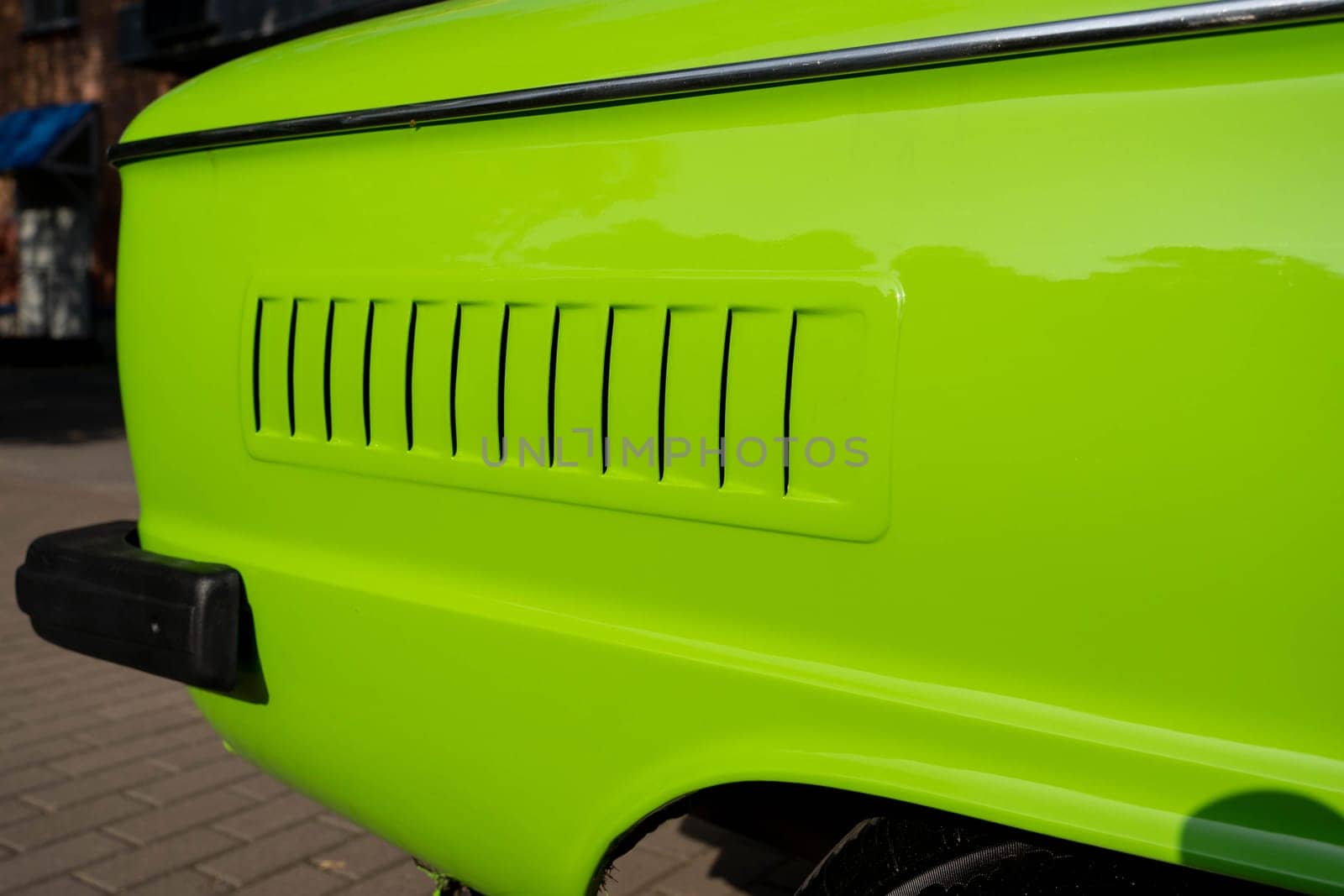 the air intake slots for the air cooling engine of the old classic car are light green. Details of retro cars. close-up and attention to detail. High quality photo