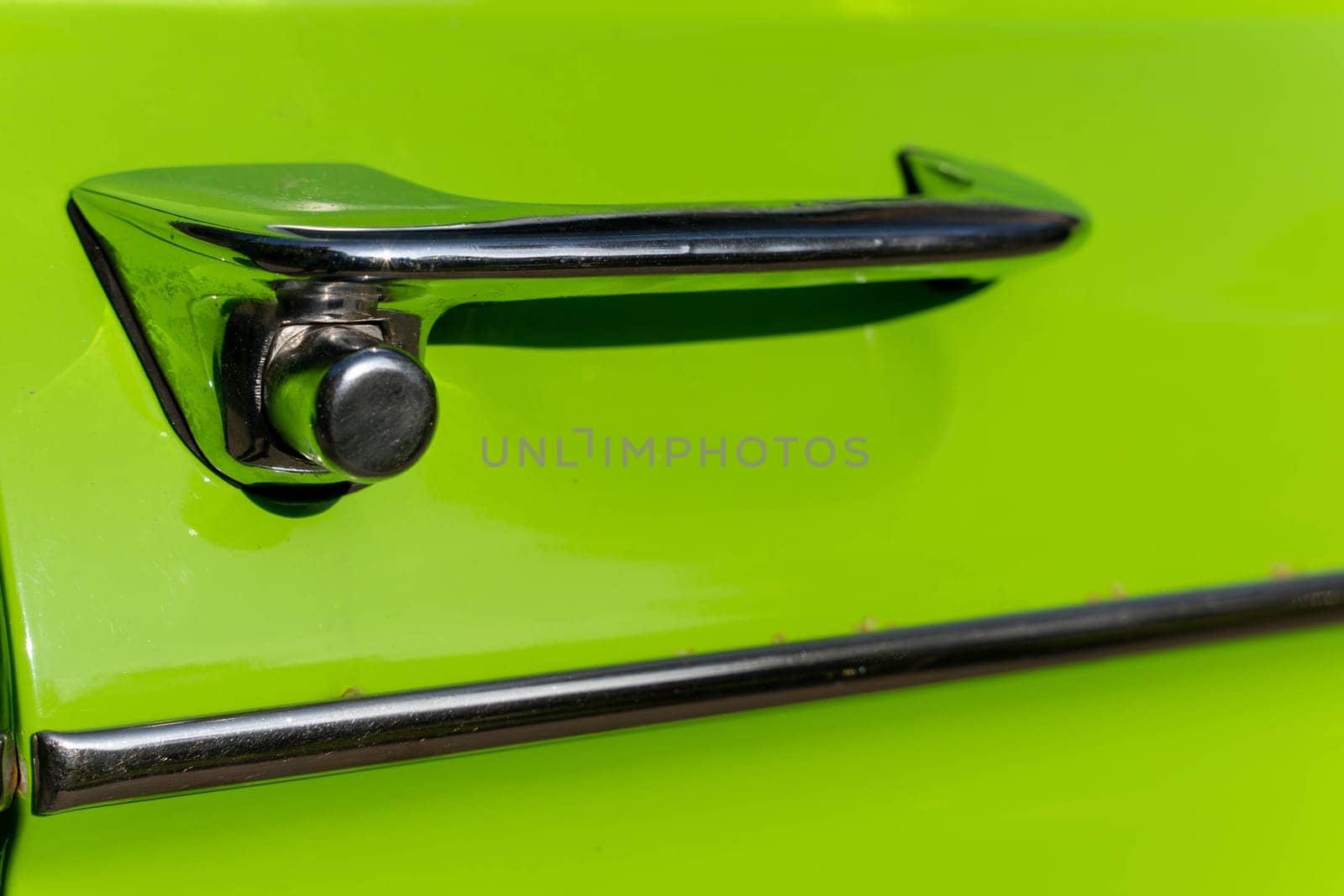 metal chrome door opening handle of an old classic car by audiznam2609