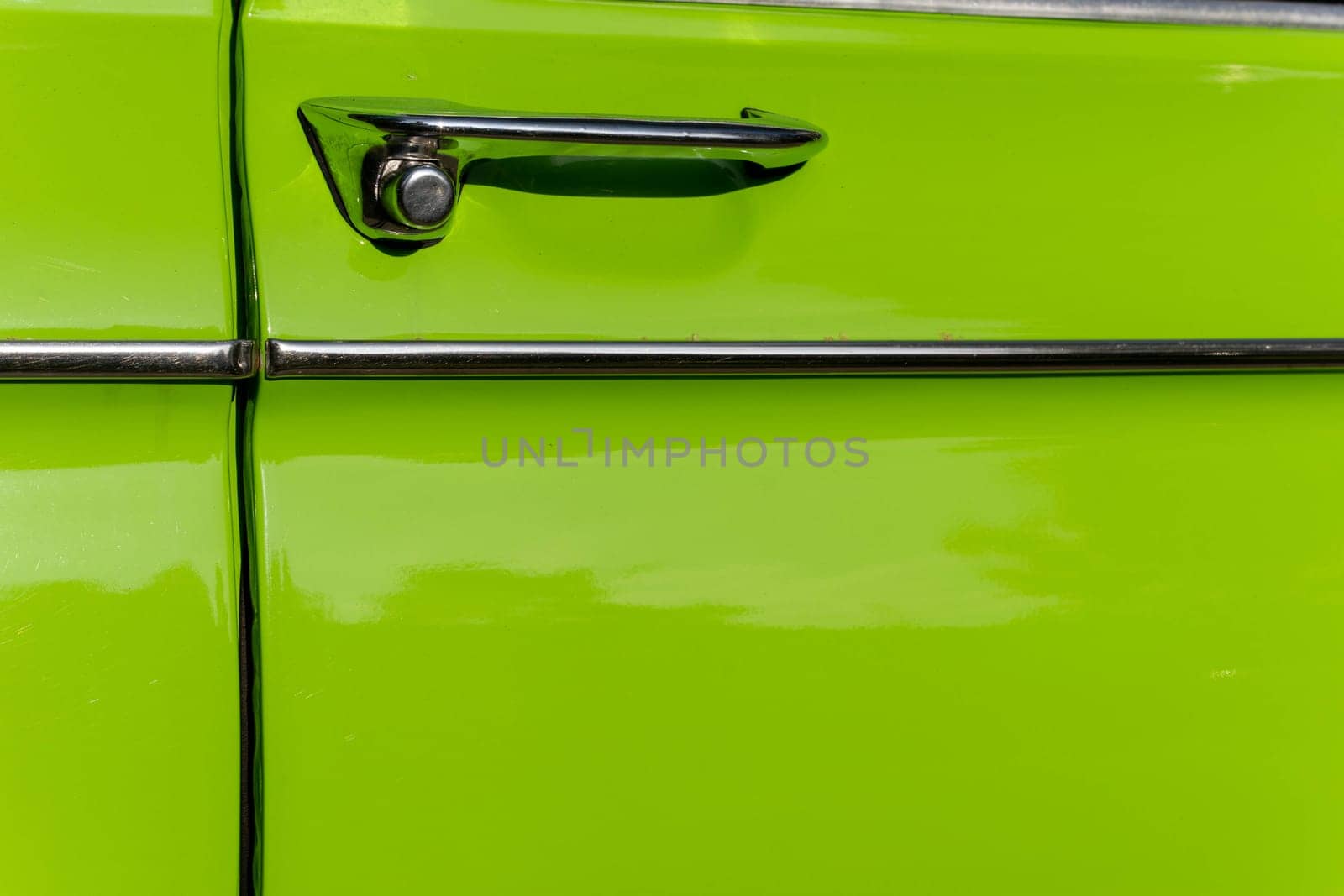 metal chrome door opening handle of an old classic car by audiznam2609