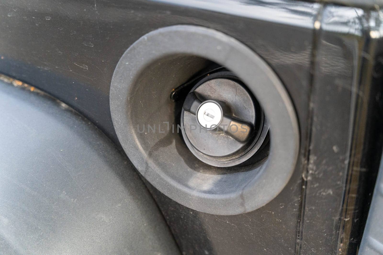 the gas tank plug of a classic SUV is lockable with a key. High quality photo