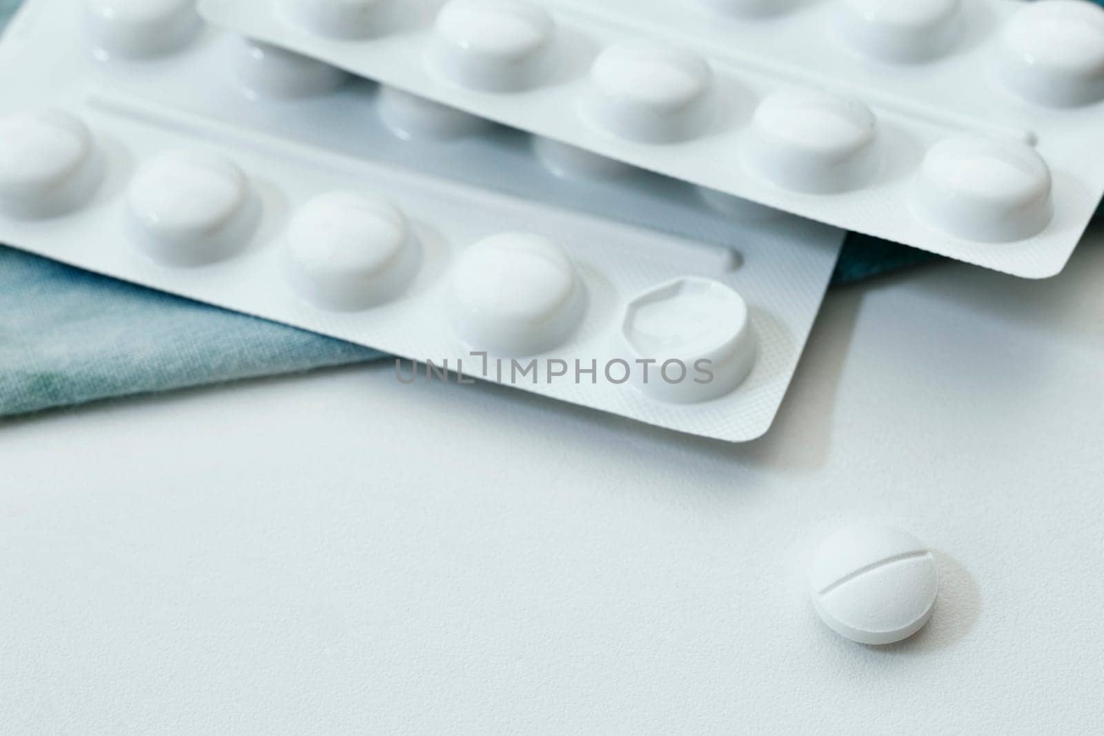  White medicine pill on table  with blisters, hearth care  and medicine