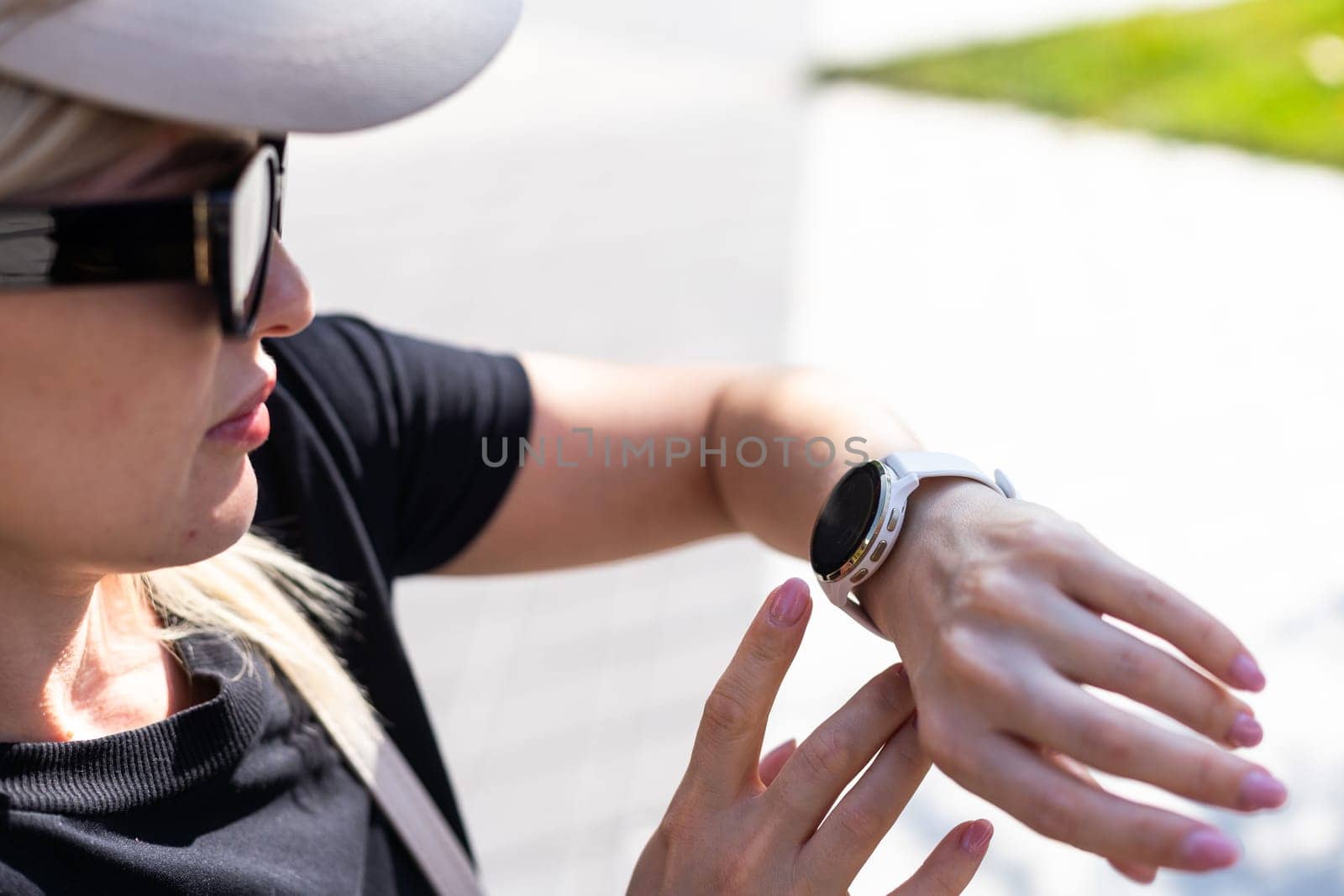 phone in the hands of a girl and a smart watch on her hand mockup. High quality photo