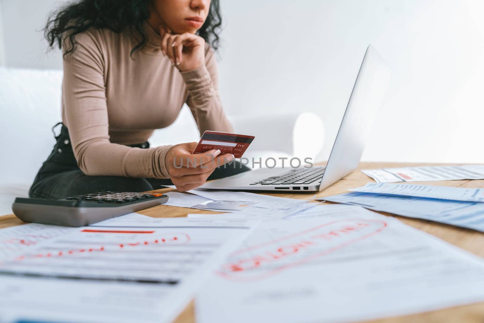 Stressed young woman has financial problems with credit card debt to pay crucial show concept of bad personal money and mortgage pay management crisis. sad and unhappy