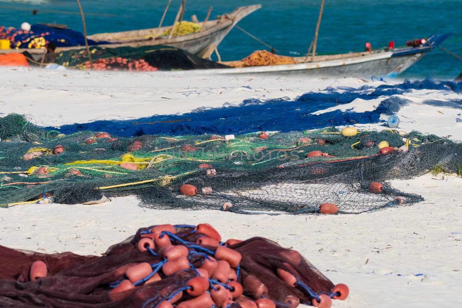 fishing nets on sandy beach by Robertobinetti70