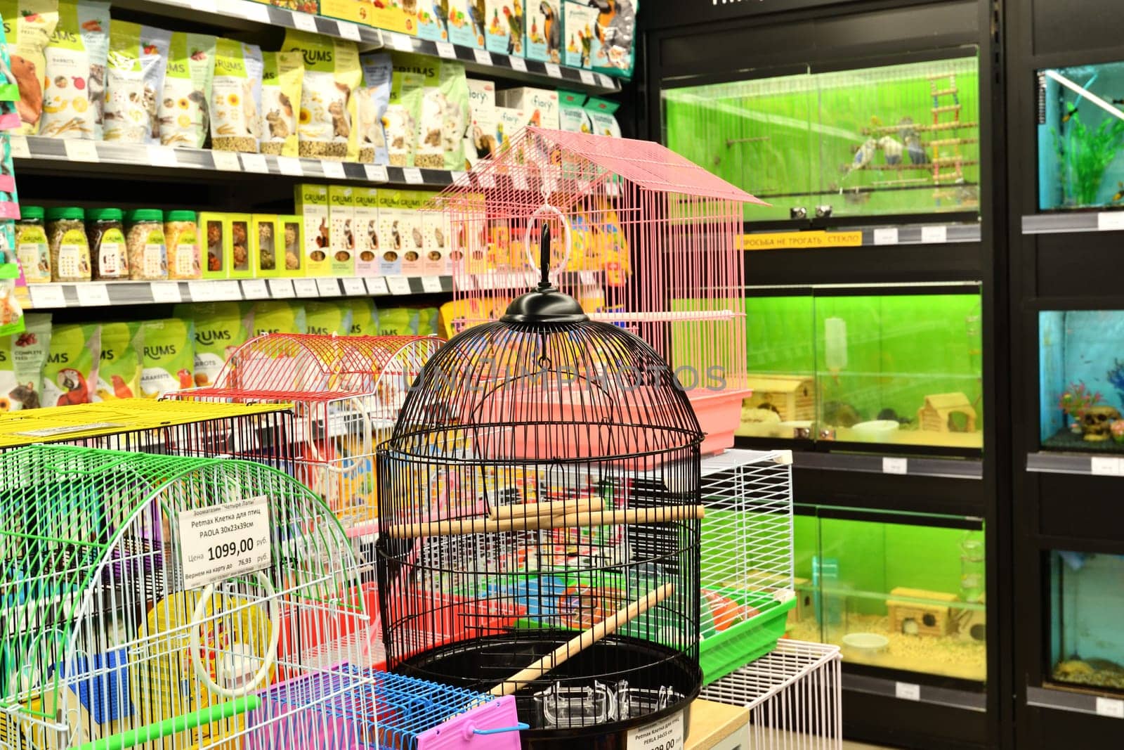 Moscow, Russia - Oct 19. 2023. Cages for birds and animals in Four paws pet store at Zelenograd by olgavolodina