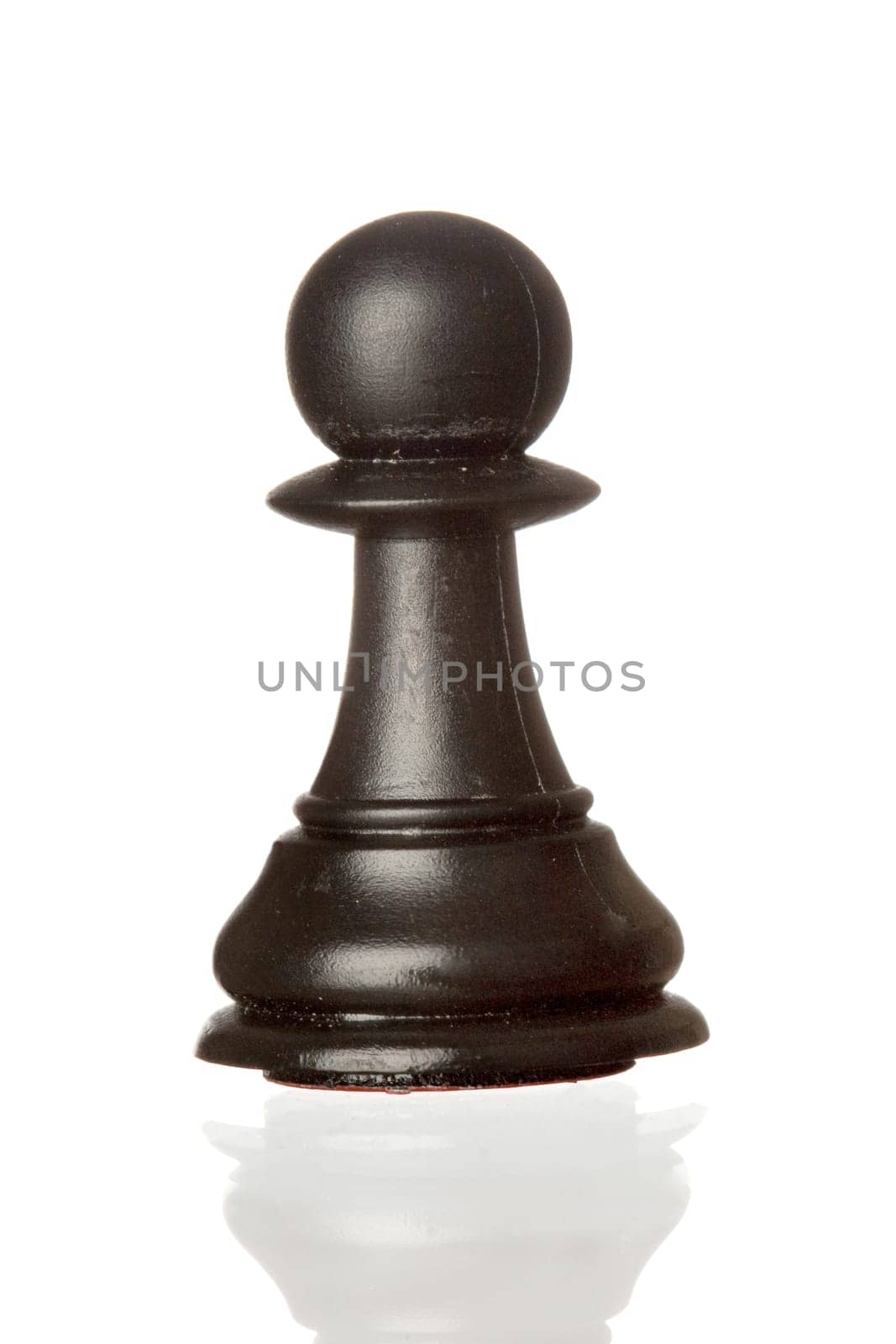 Black pawn isolated on white background with reflection on the floor
