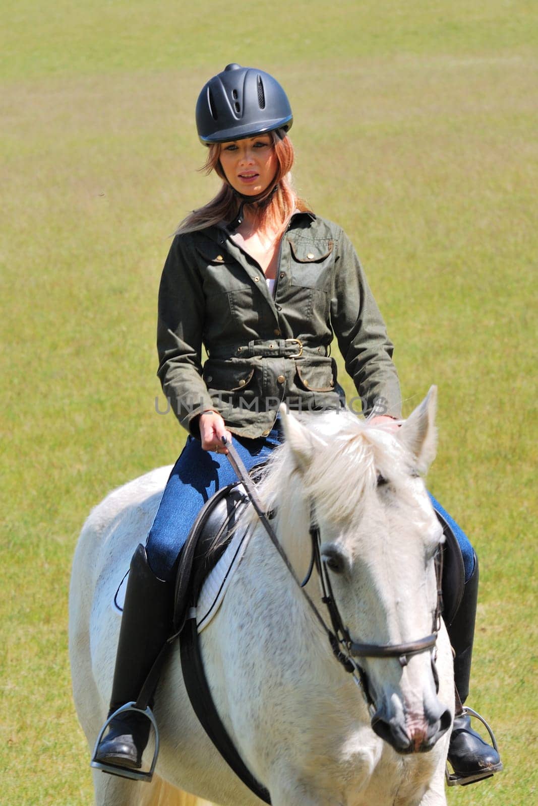 Girl riding white horse