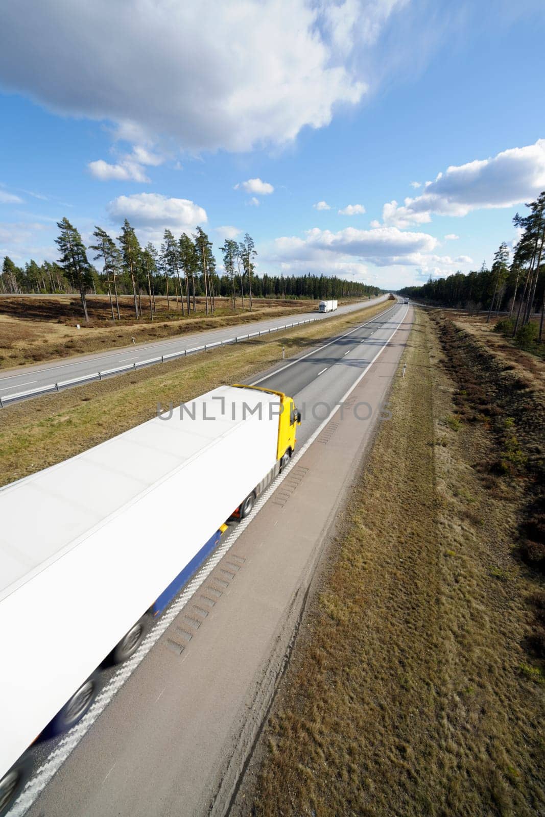truck driving on scenic highway, elevated view from above
