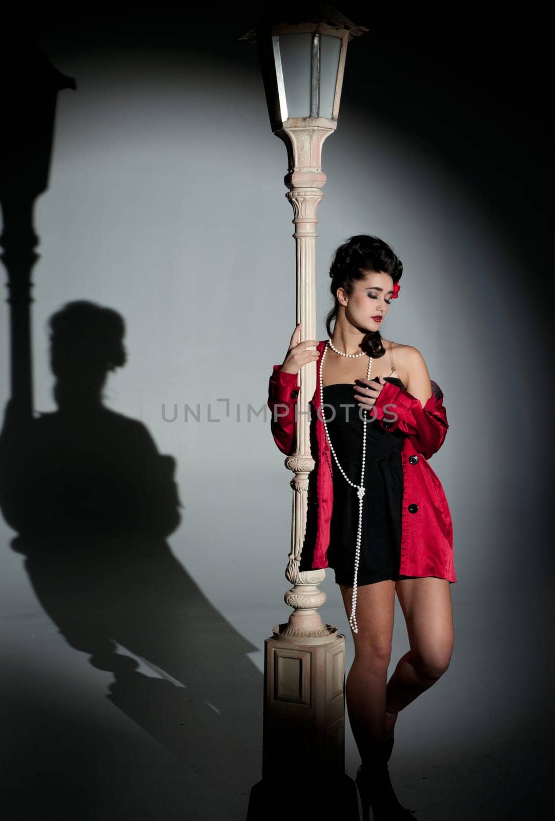 beautiful young glamorous woman  with lightpole