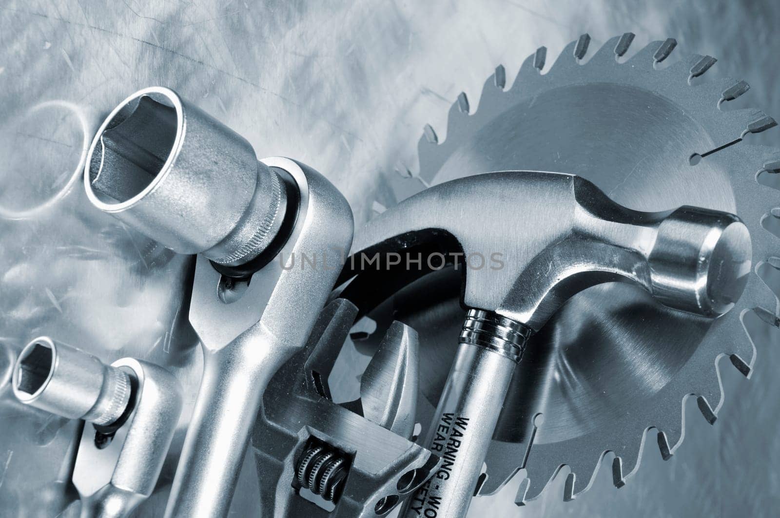various hand tools, hammer, wrench, saw, blades, and in a slight blue toning concept