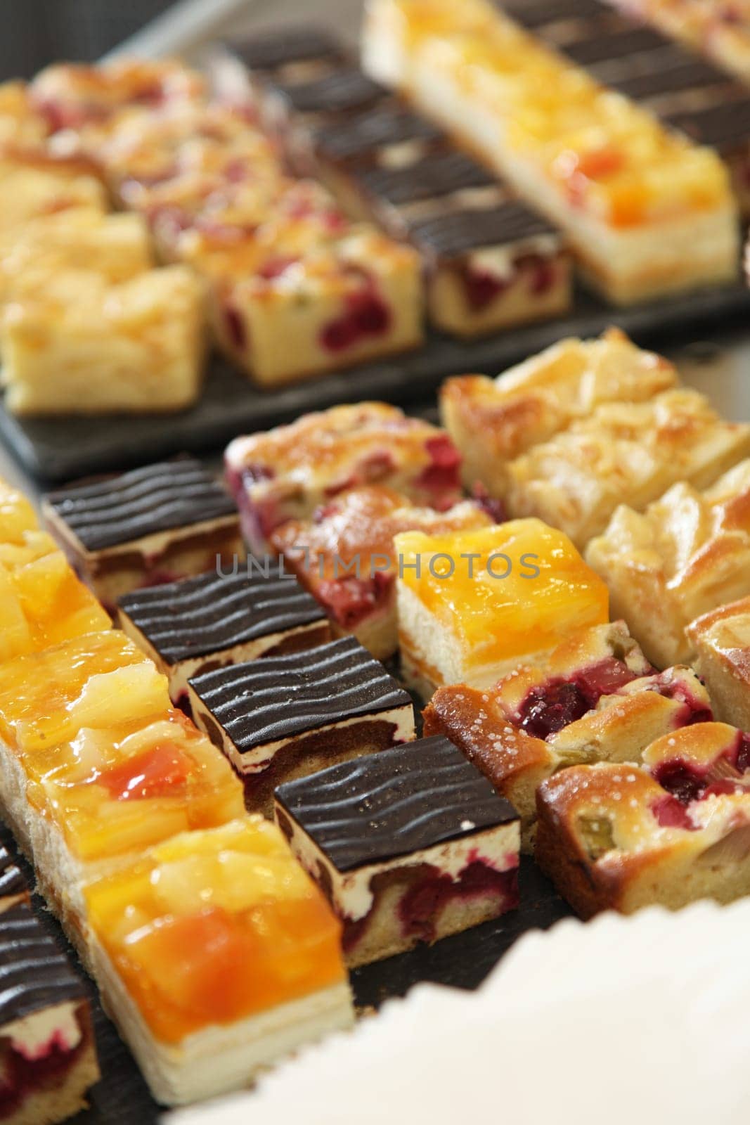 Cake buffet with various delicious cakes - portrait format - close-up