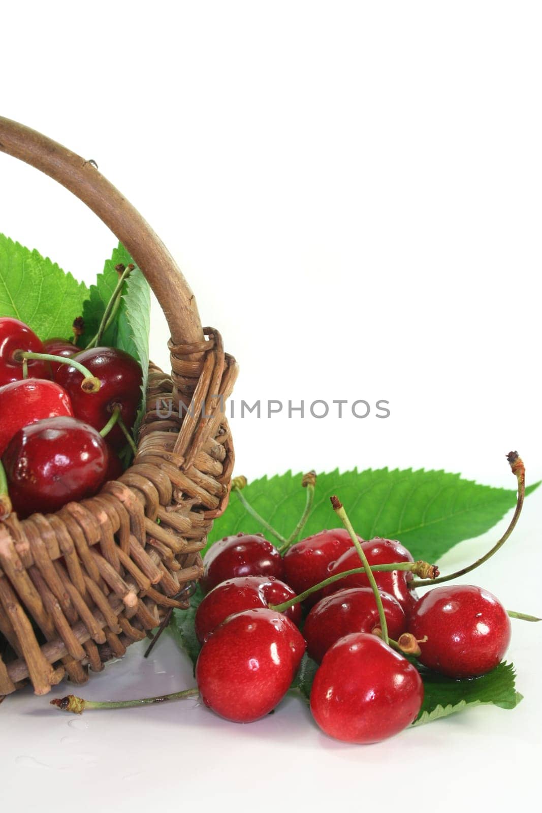 a basket filled with fresh cherries