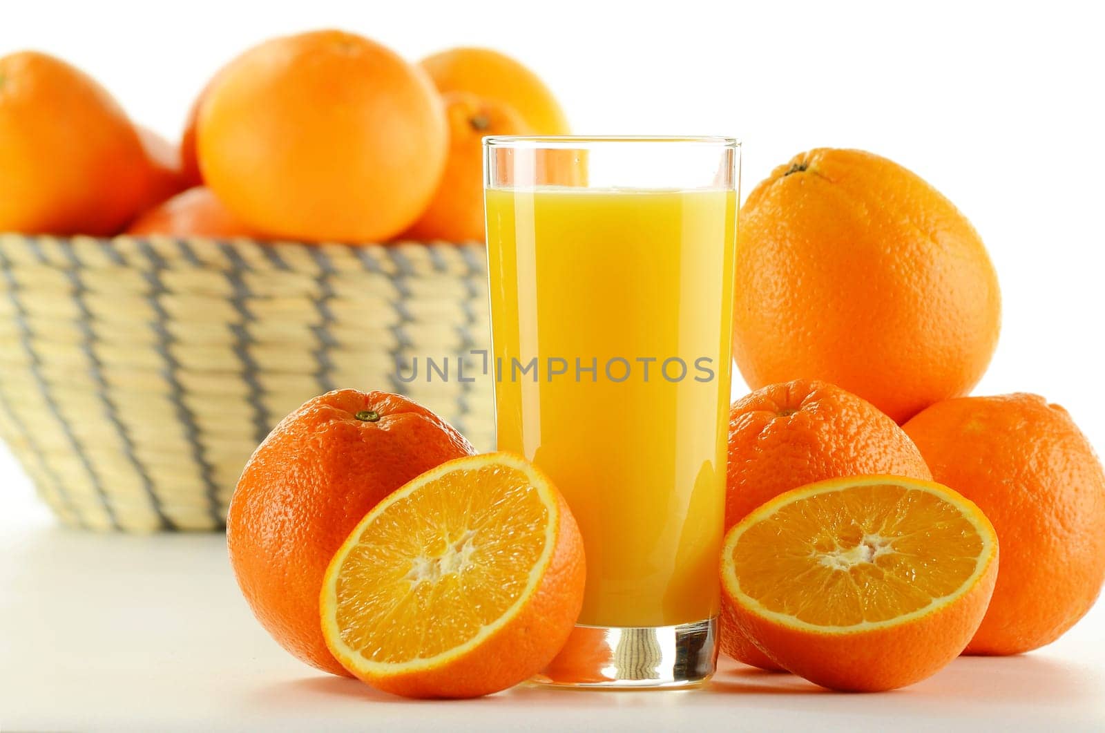 Composition with glass of orange juice and fruits