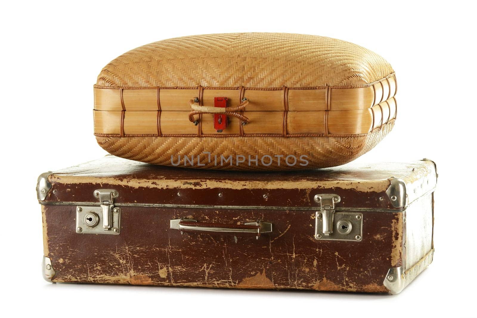 Two old travel suitceses isolated on white