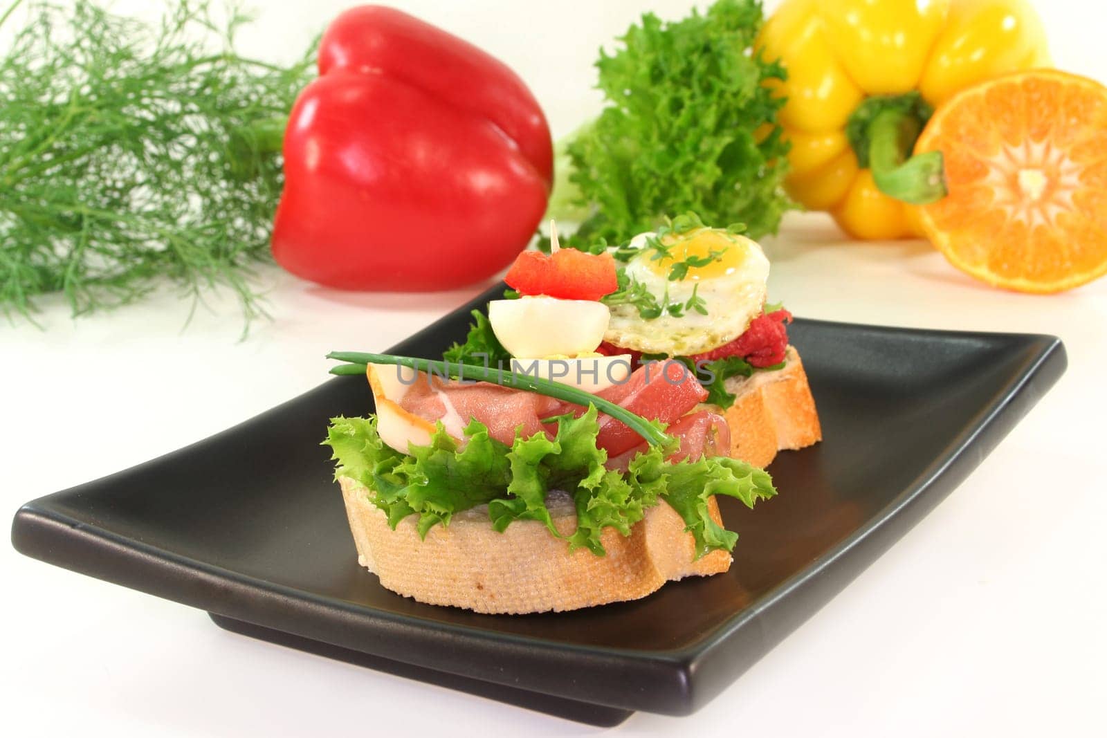 Various canapes against white background