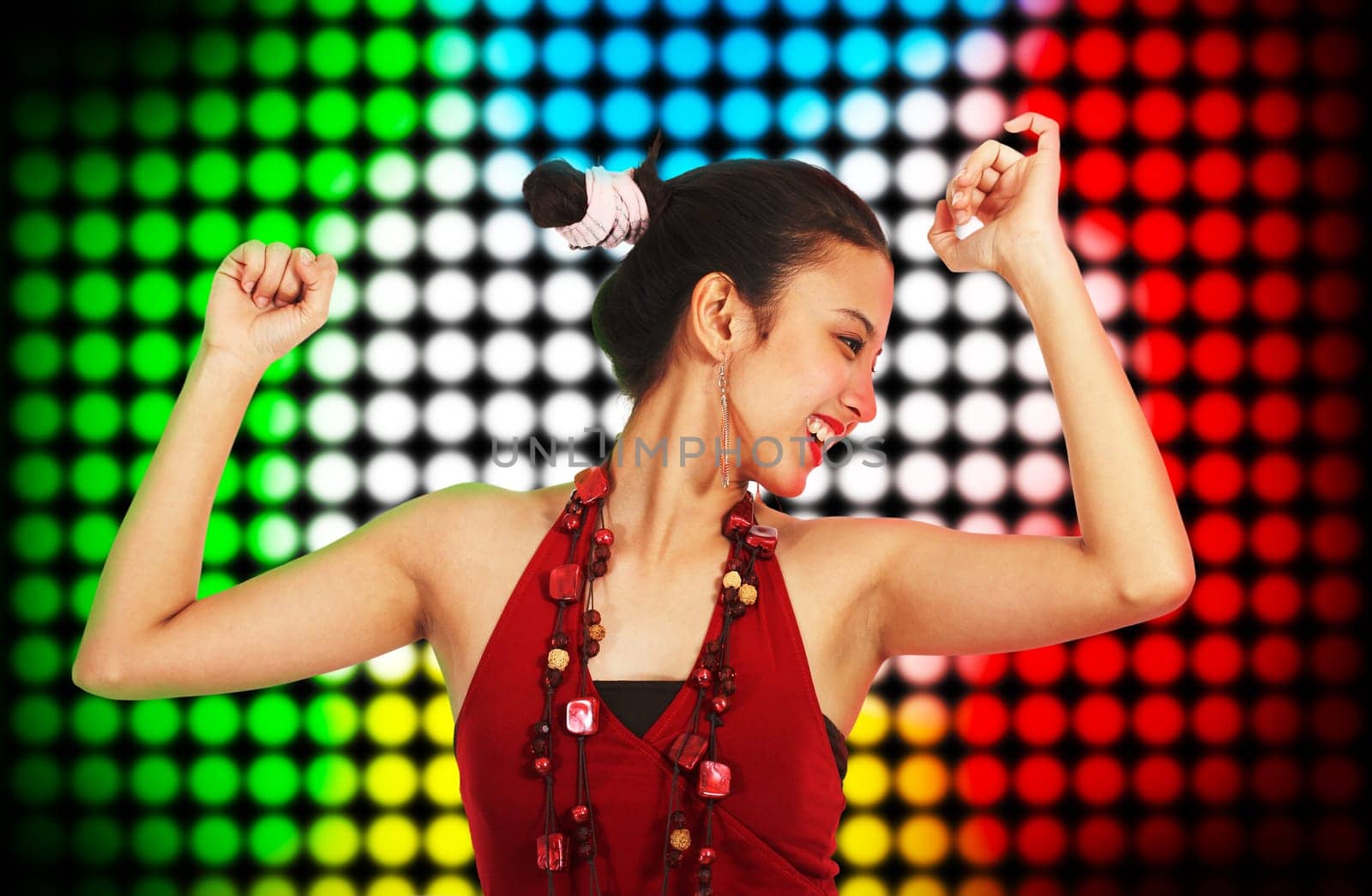 Beautiful Young Woman Dancing At A Club With Multicolored Spotlights Background