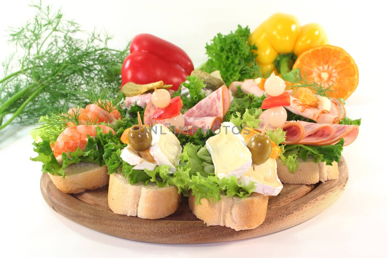 Various canapes against white background