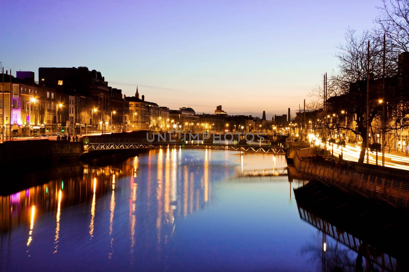 Dublin City at sunset - view over the river Liffey and historical Grattan bridge. Long exposure, tripod used.