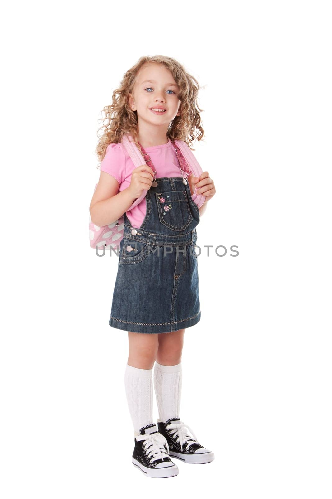 Beautiful girl with backpack happy and ready to go back to school, isolated.