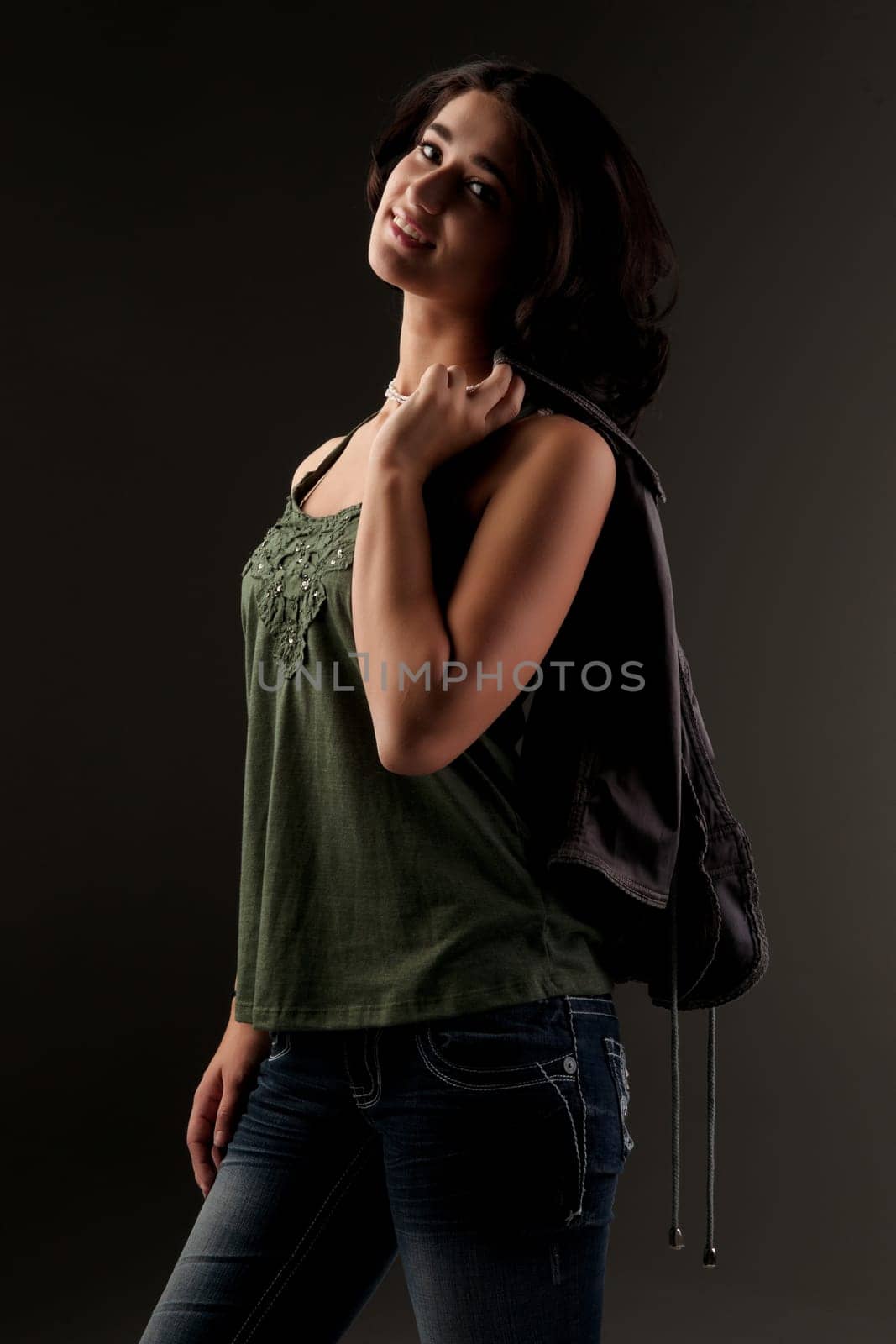 beuatiful young fashion teenager on dark gray