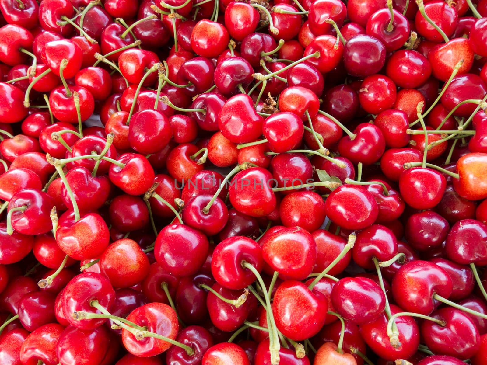 Cherries,red fresh fruit can also be used as a background