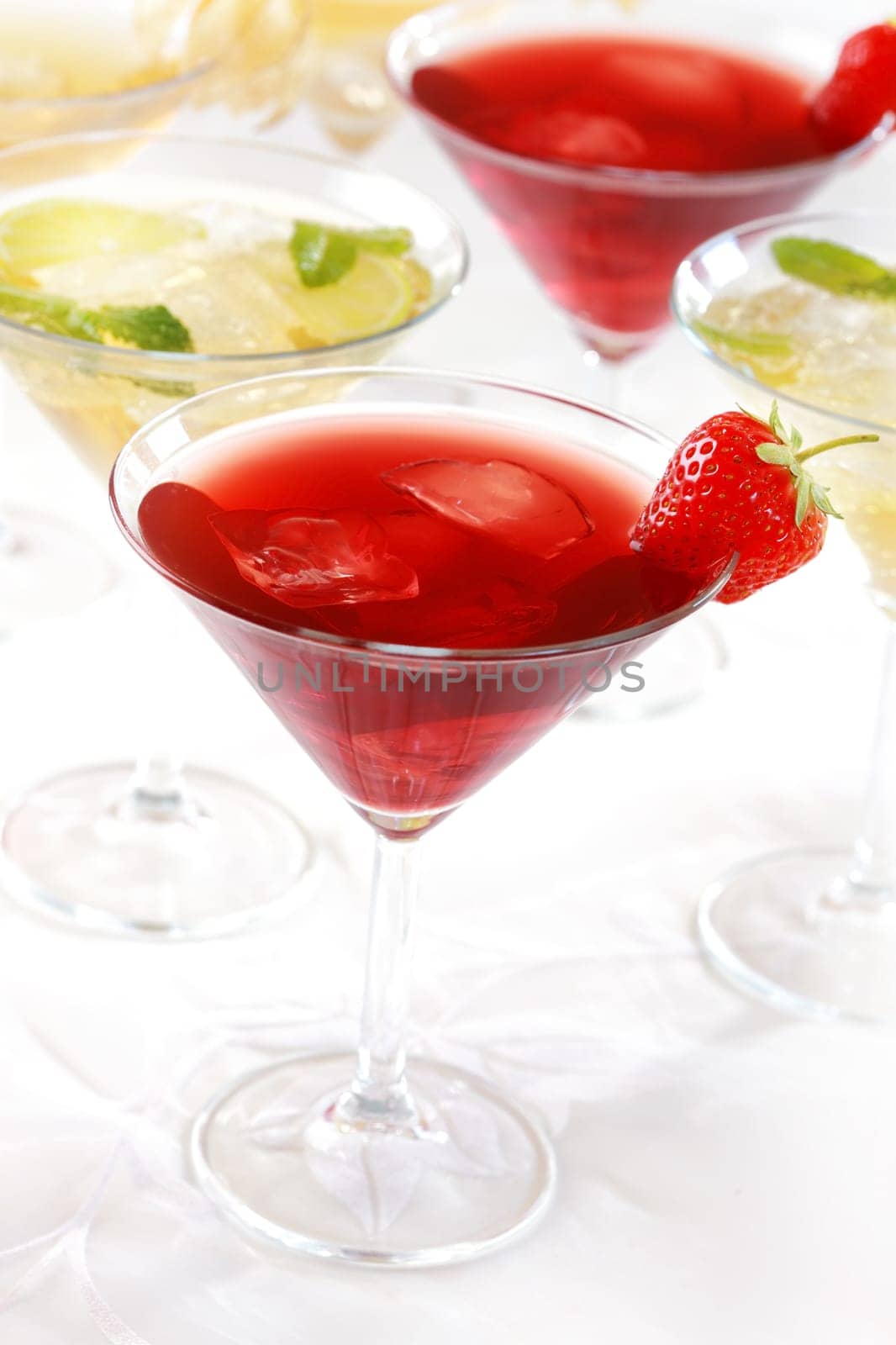 Different cocktails or longdrinks garnished with fruits
