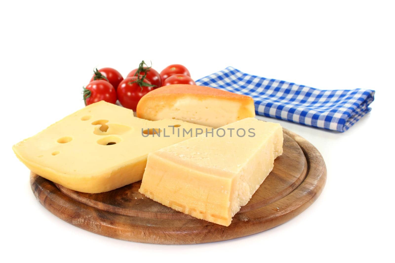 different types of cheese on a wooden board