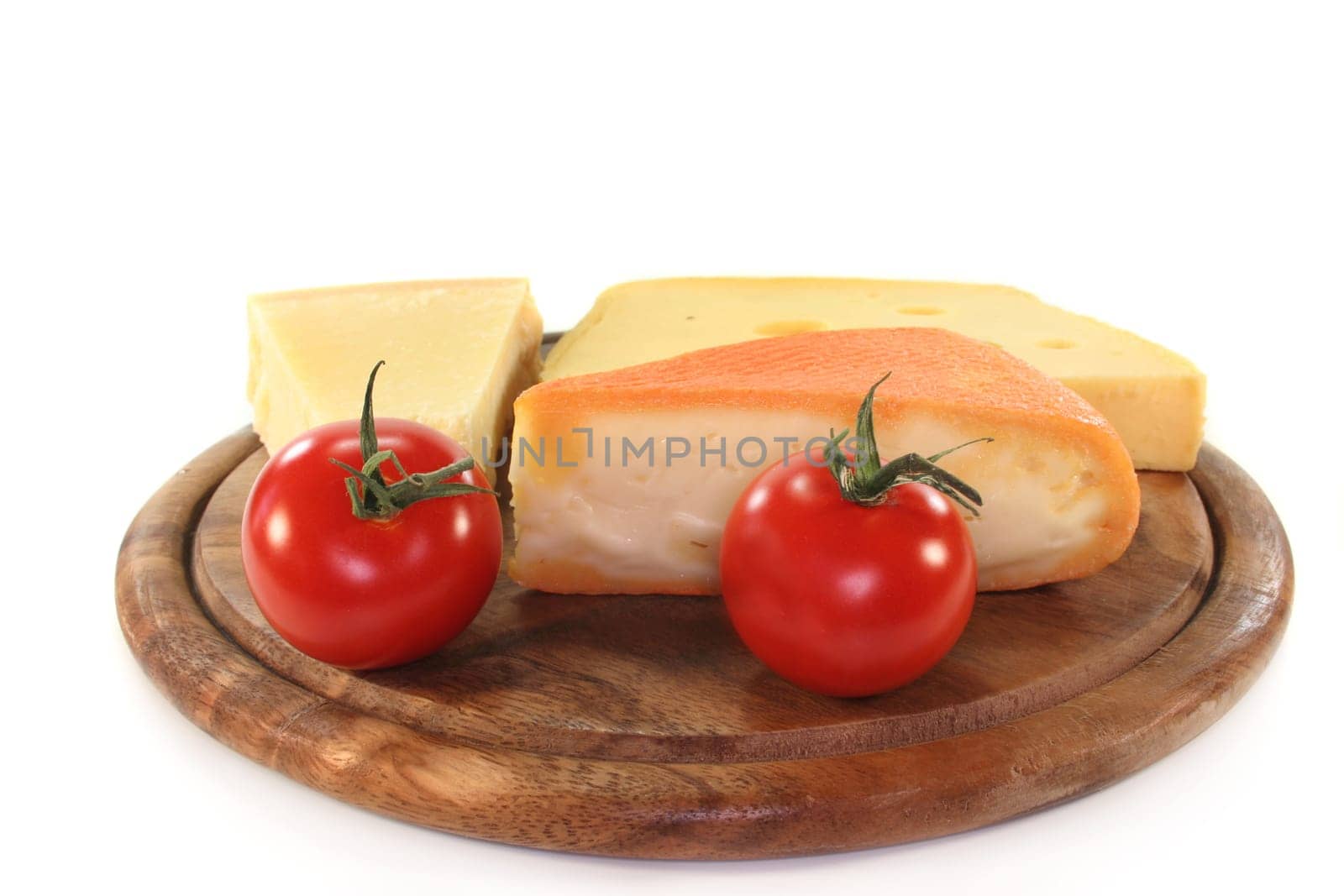 different types of cheese on a wooden board