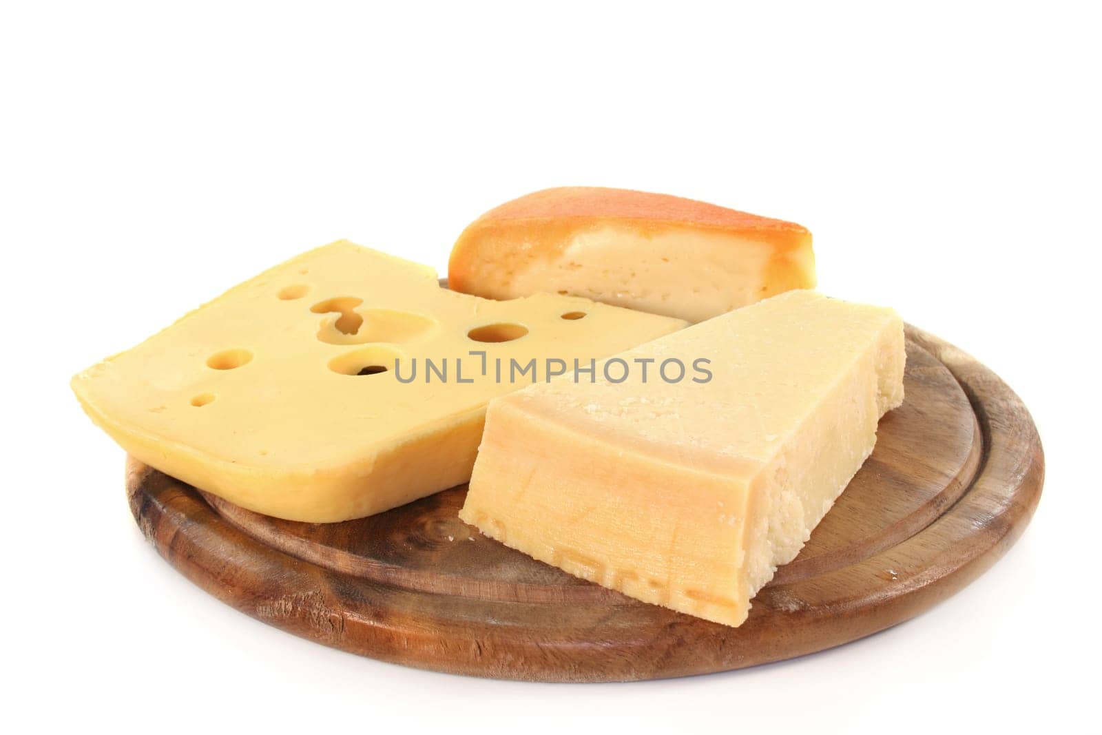 different types of cheese on a wooden board