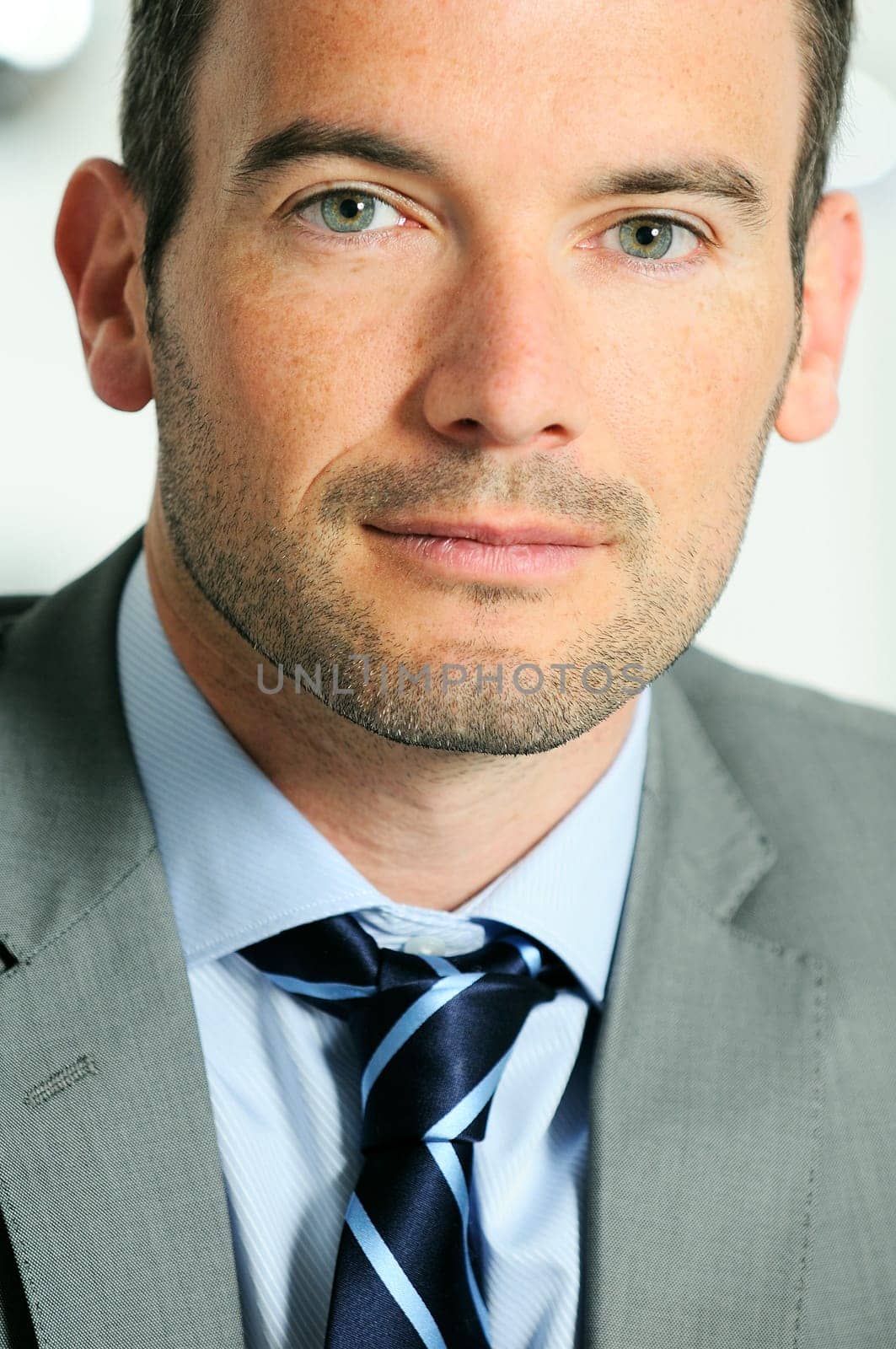 An attractive business man in a light business environment