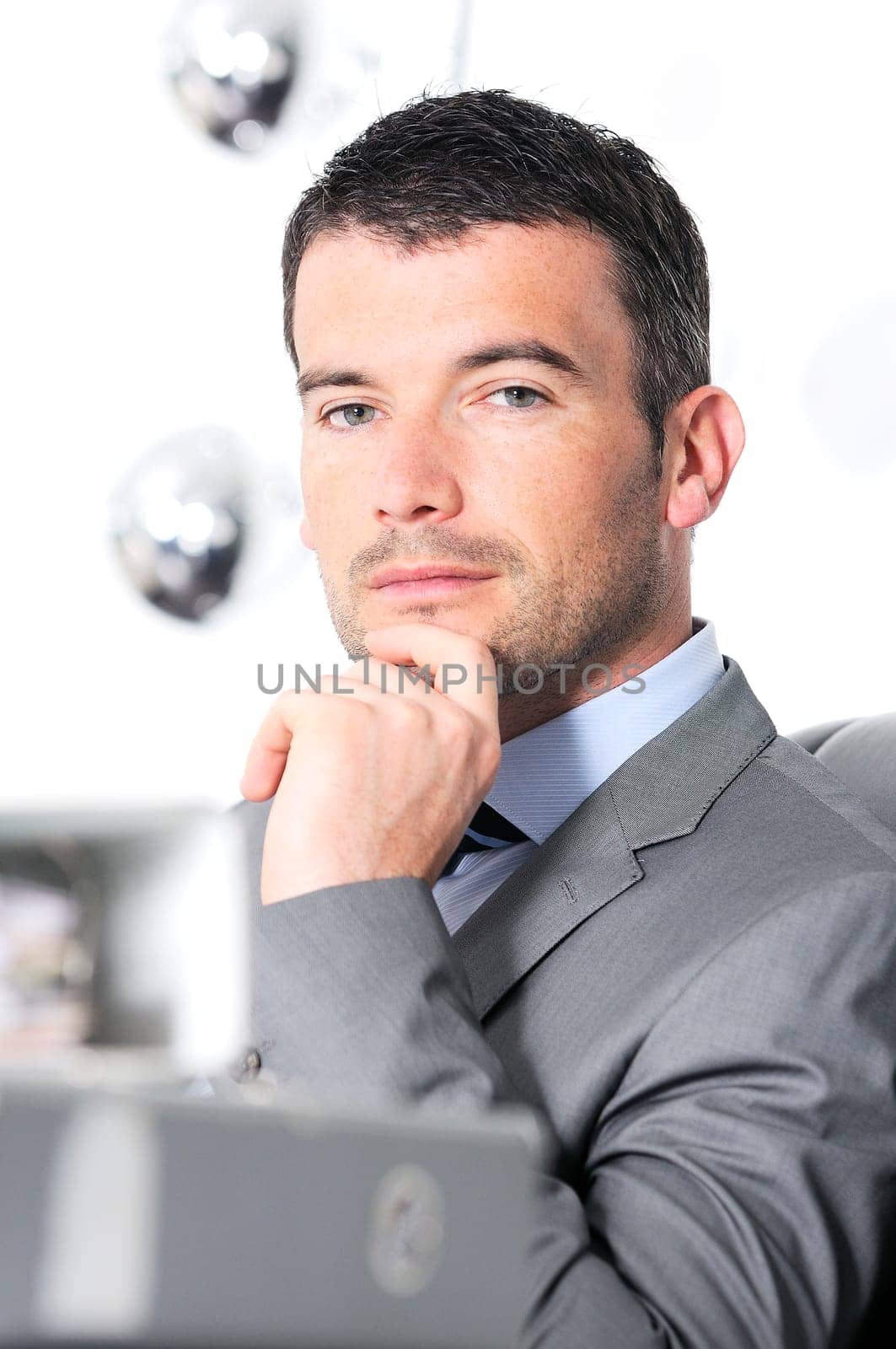 An attractive business man in a light business environment