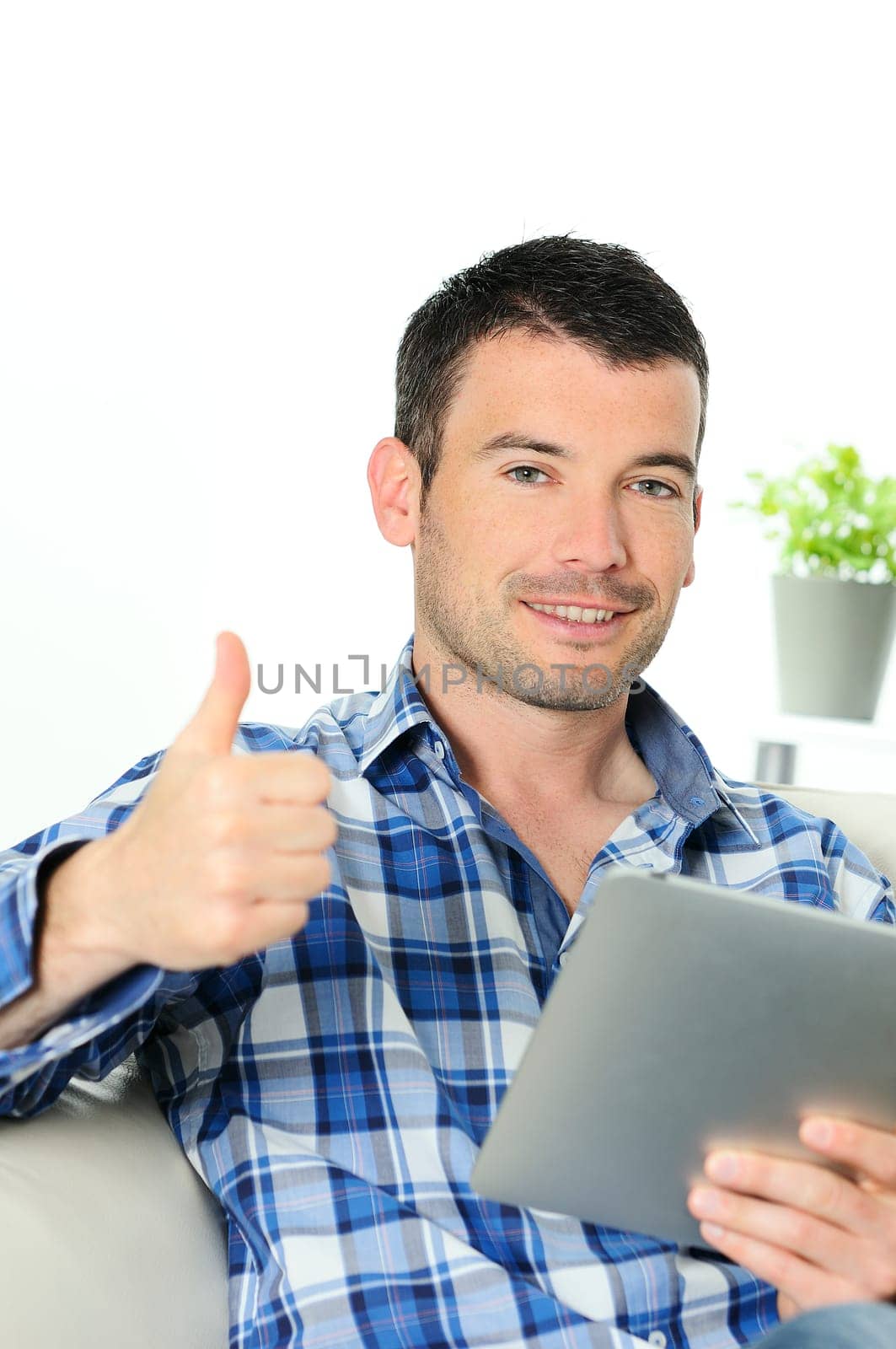 attractive relaxed and positive man is surfing on his