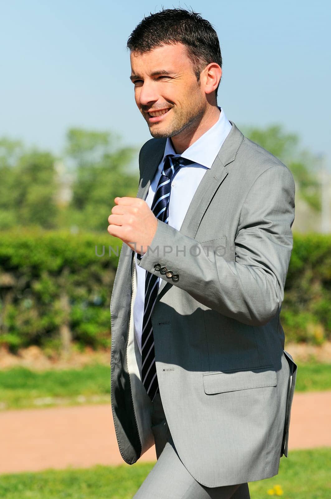 Portrait of a businessman outdoor with winner spirit