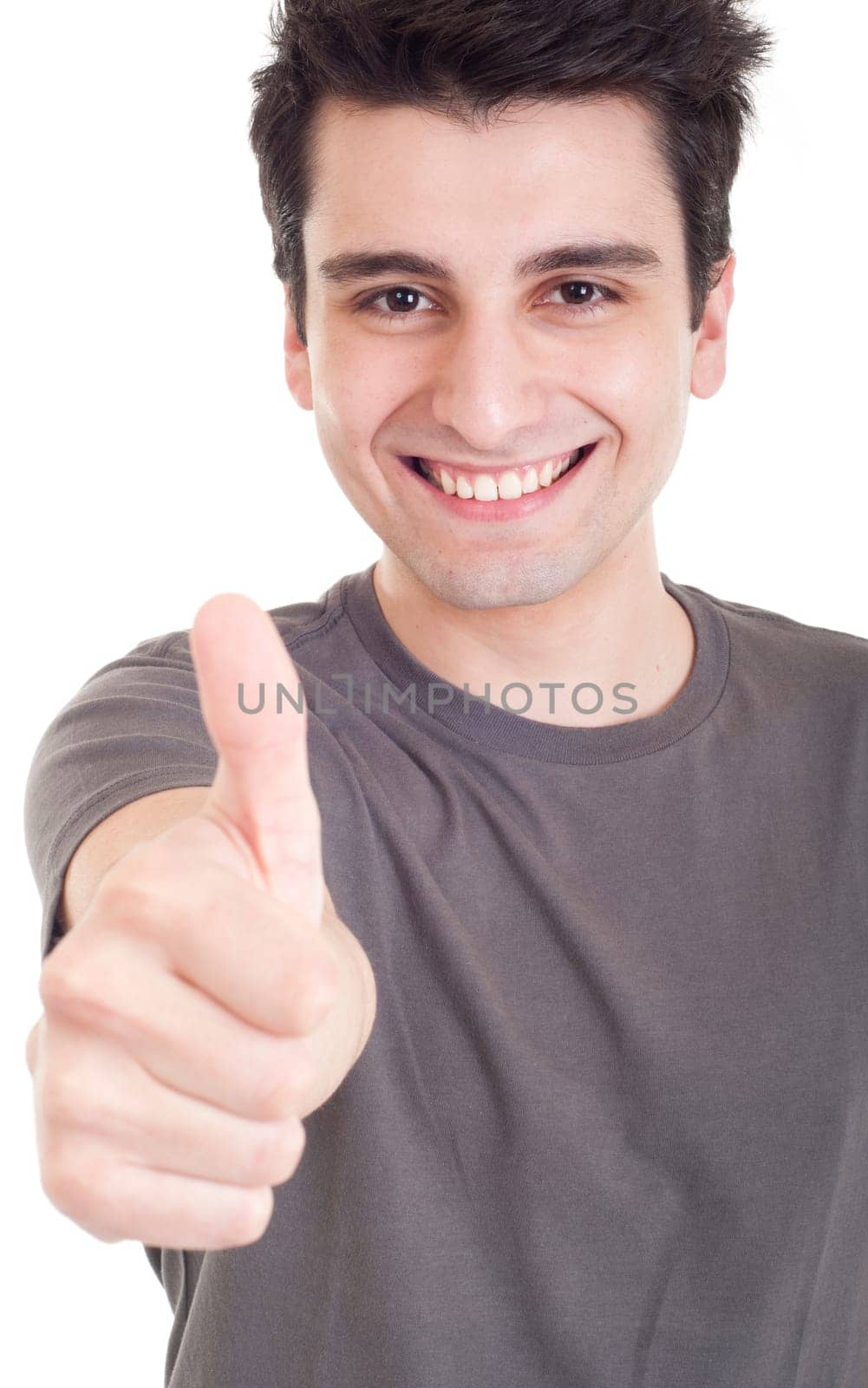 smiling young man with thumbs up (focus on hand) on an isolated white background