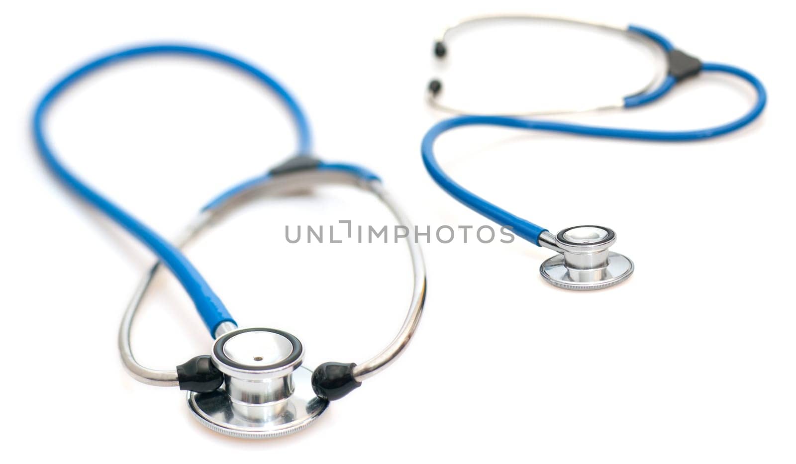 Two Blue Stethoscopes on White Background