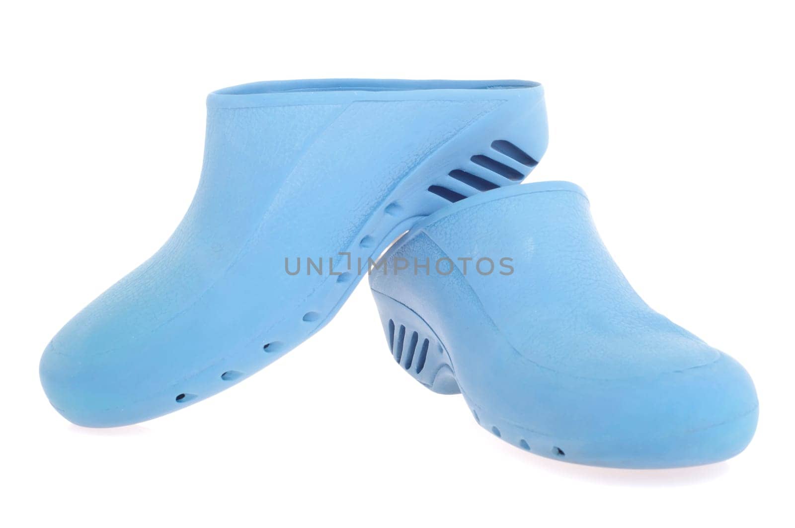 pair of blue anti static surgery clogs isolated on white background