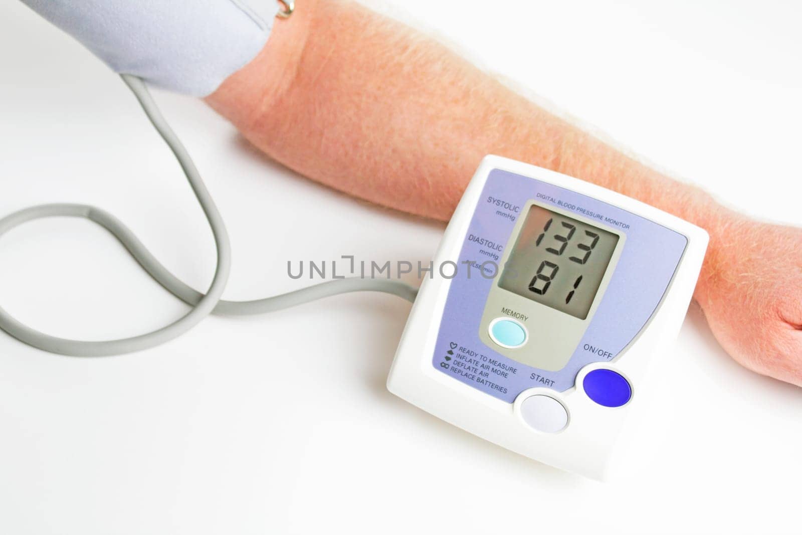 Man measuring his own blood pressure