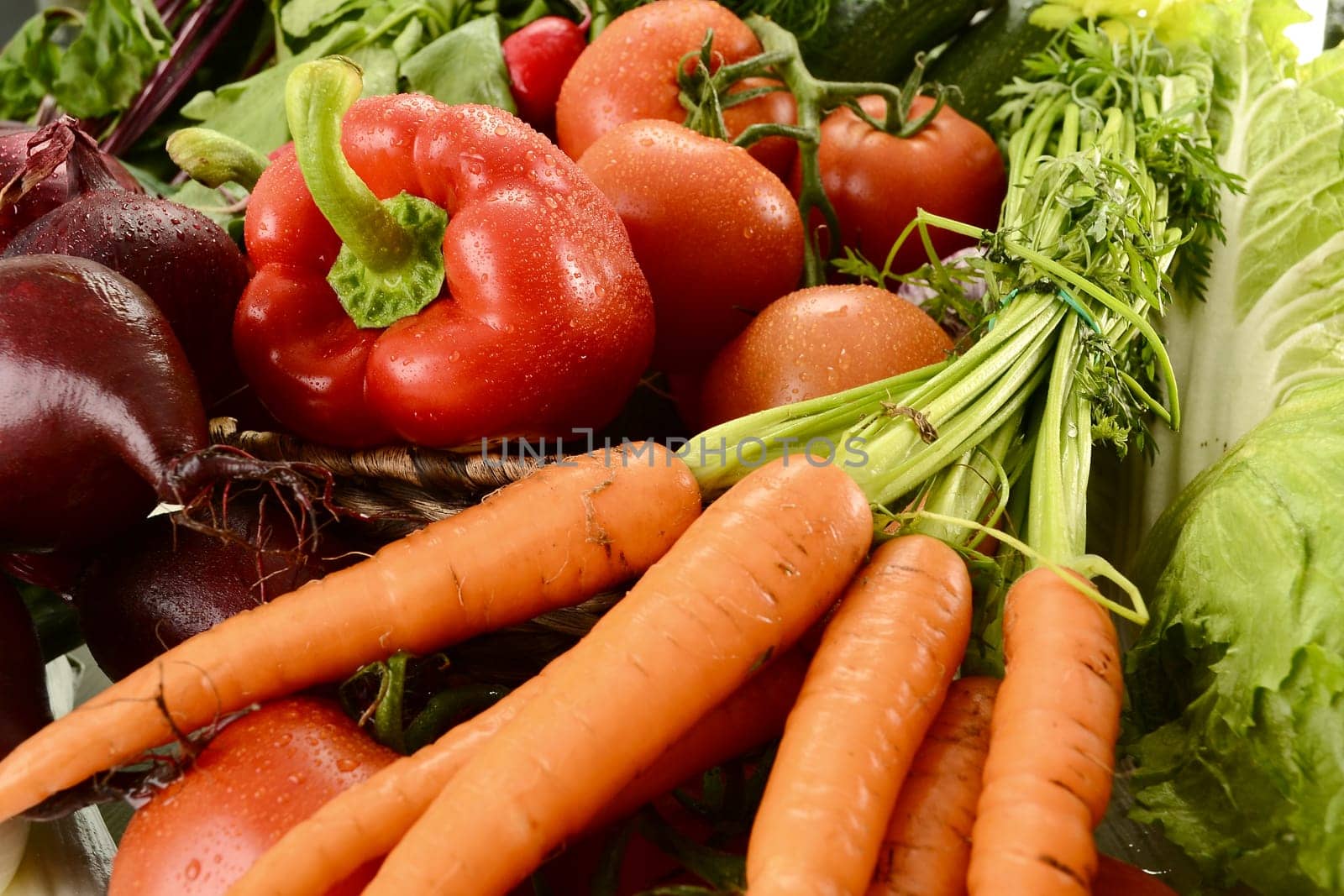 Composition with raw vegetables and wicker basket