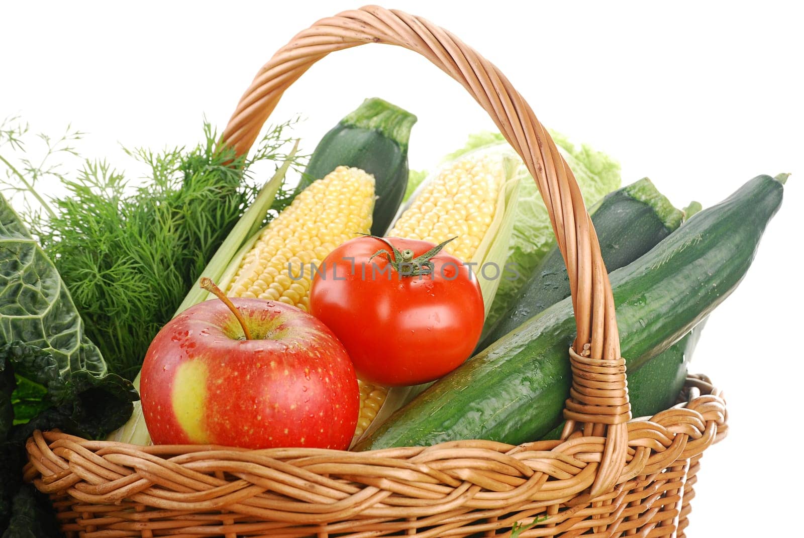 Composition with raw vegetables and wicker basket