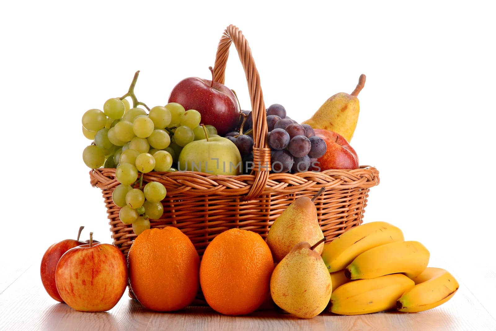 Composition with fruits and wicker basket