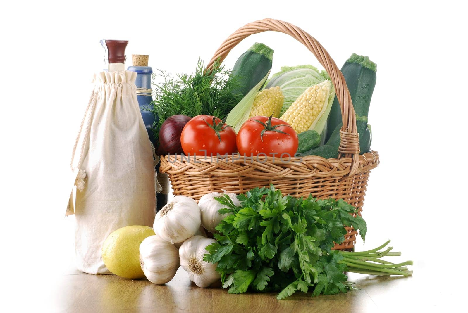 Composition with raw vegetables and wicker basket