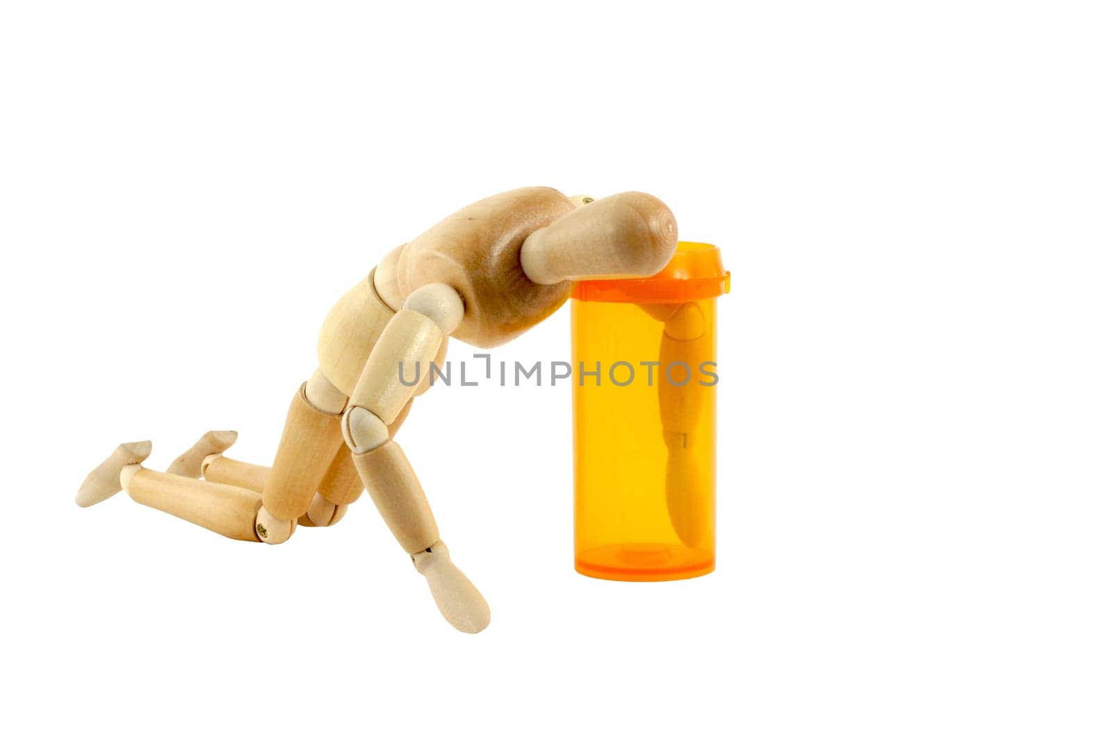 A Manikin reaching in pill bottle